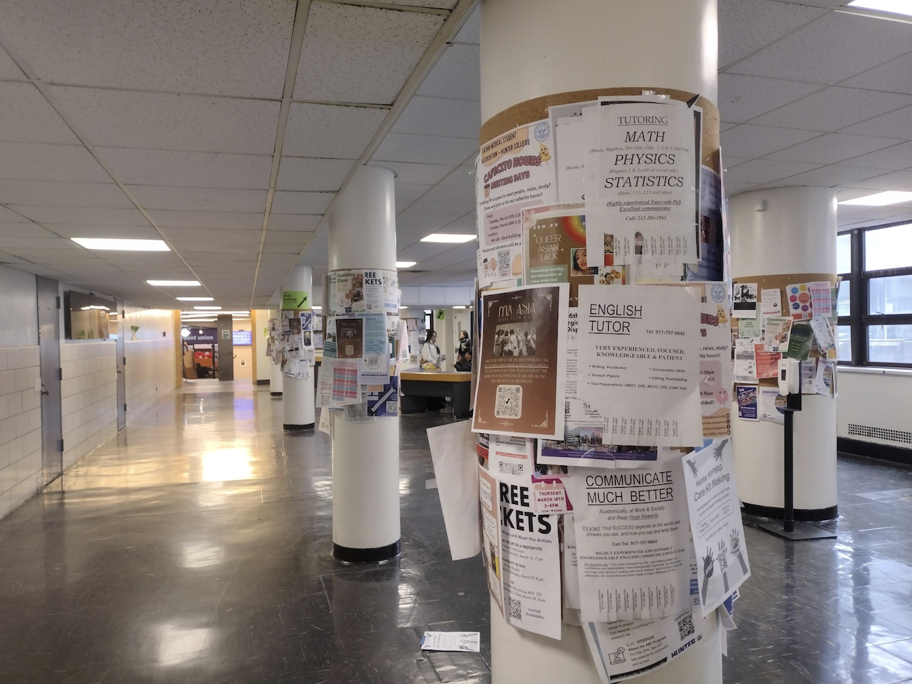 Flyers at the third floor area of the North Building. Papers stapled on top of one another on every cork board.